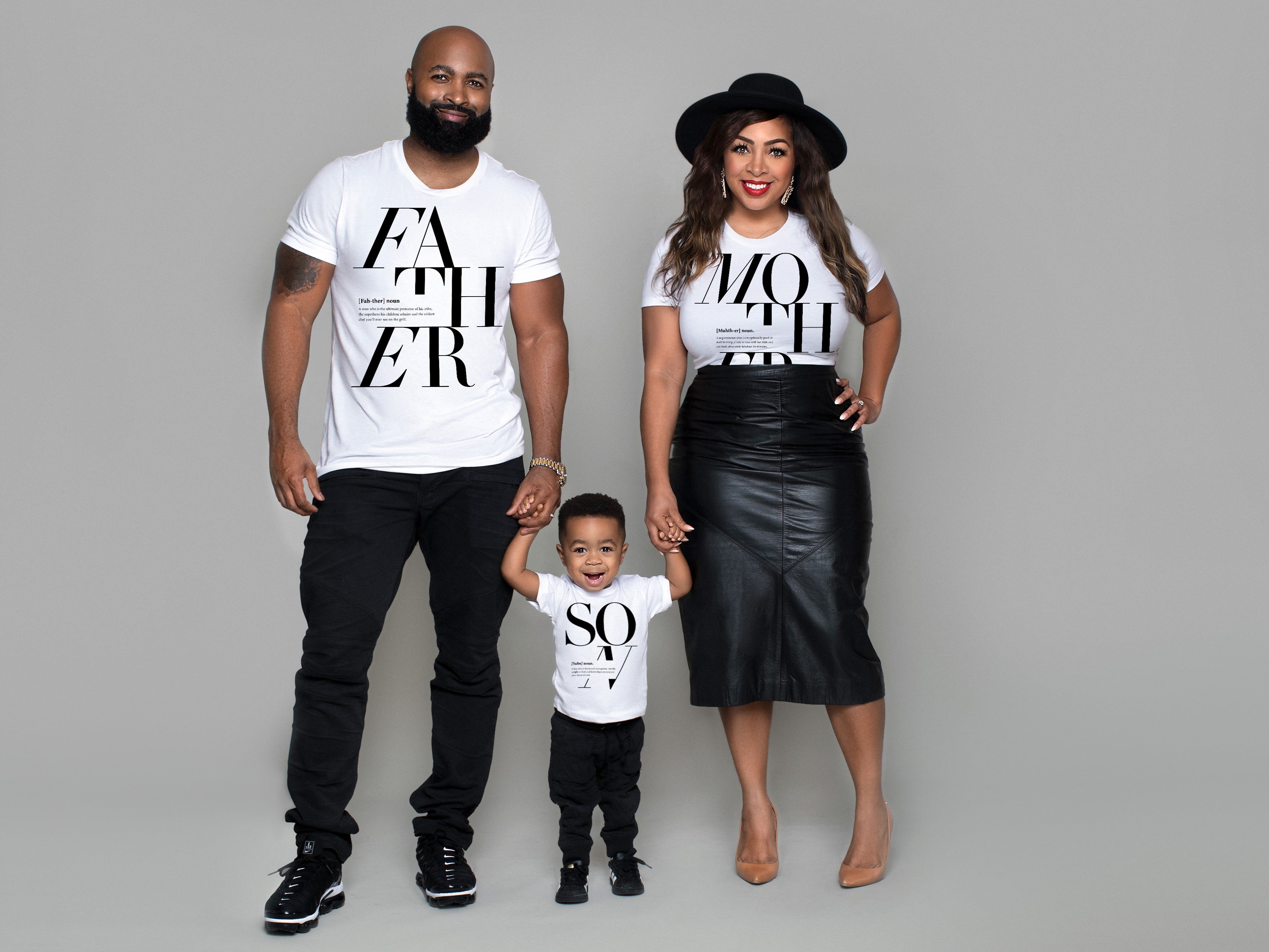 Beautiful African American family with a father mother and son in matching family t-shirts