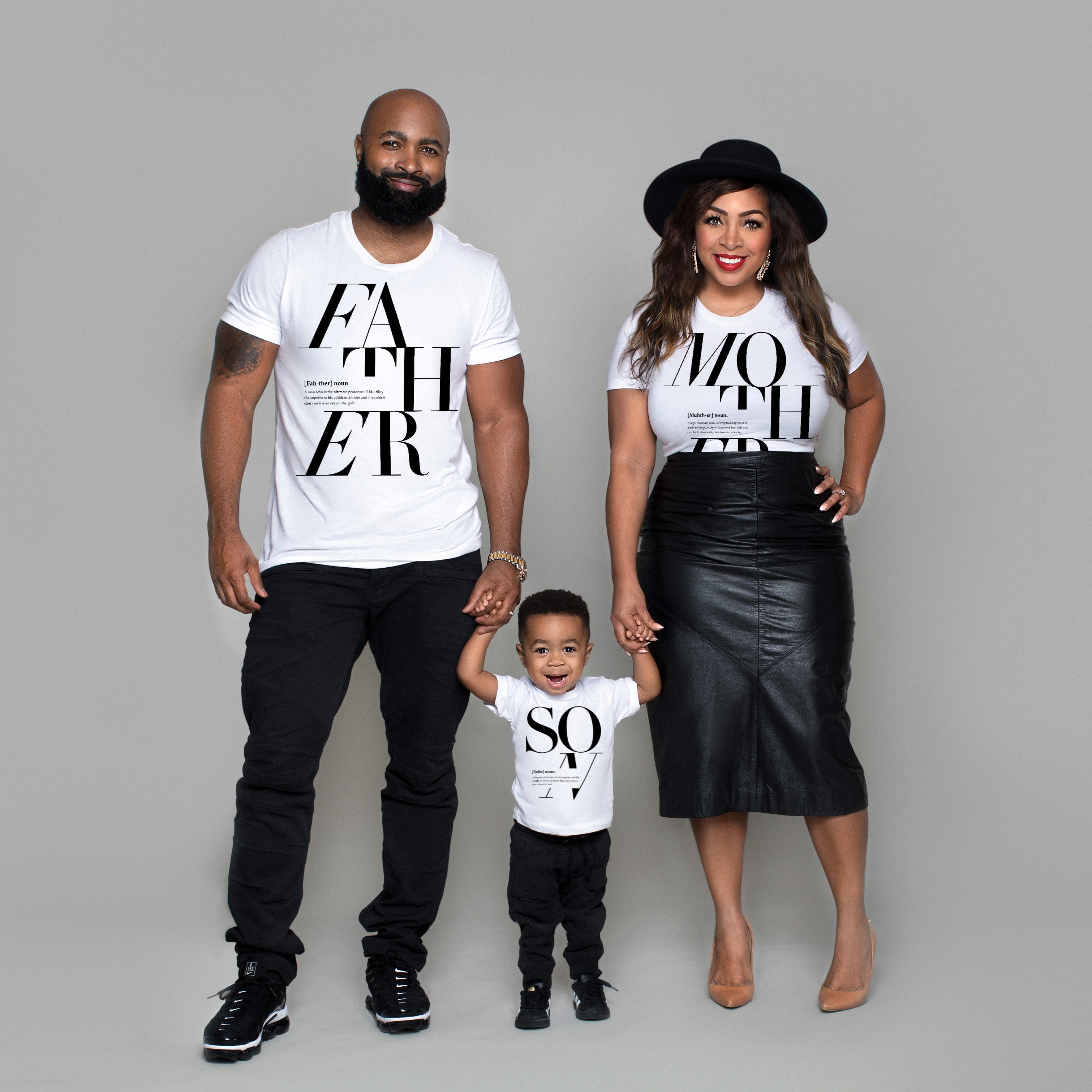 Beautiful African American family with a father mother and son in matching family t-shirts